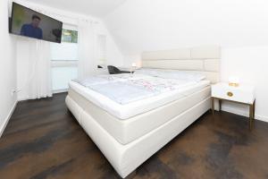 Postel nebo postele na pokoji v ubytování Ferienhaus Nordseeperle