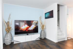 TV a/nebo společenská místnost v ubytování Ferienhaus Nordseeperle