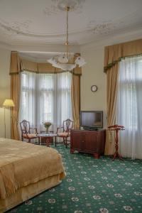 TV a/nebo společenská místnost v ubytování Hotel Mignon