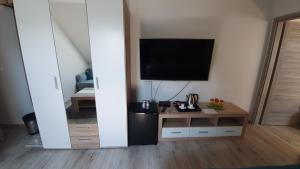TV a/nebo společenská místnost v ubytování PATTY Garni