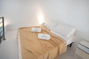Postel nebo postele na pokoji v ubytování WePuglia - Dimore Stefania