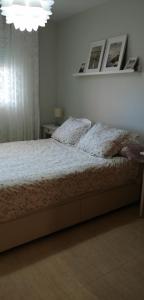 Postel nebo postele na pokoji v ubytování RESIDENCIAL LAS PALMERAS