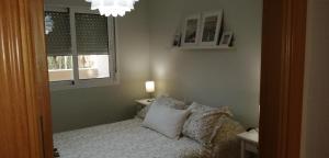 Postel nebo postele na pokoji v ubytování RESIDENCIAL LAS PALMERAS