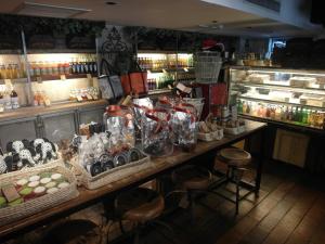 a store with a counter with a lot of items at French Hotel in Ipoh