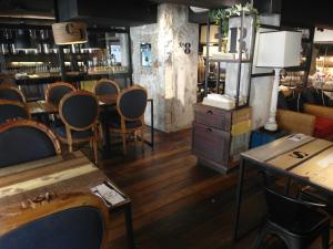 a room with chairs and tables in a store at French Hotel in Ipoh