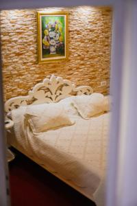 Letto o letti in una camera di Hotel Lula