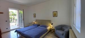 מיטה או מיטות בחדר ב-Casa Sandra Bertolini