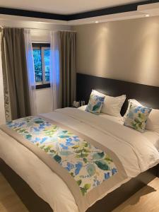 Giường trong phòng chung tại Hôtel Select - Réunion