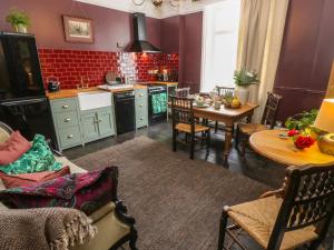 a kitchen with a table and a dining room at Dreytop in Ryde