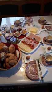 a table with many different types of food on it at Bio-Bauernhof Schiederhof in Fusch an der Glocknerstraße