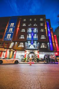 a building with blue and purple lights on it at aSa Boutique Hotel in Haskovo