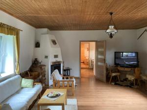 a living room with a couch and a table at Chalupa na samote in Pliešovce