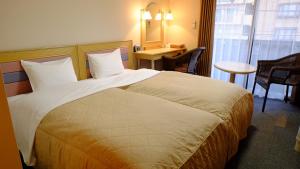 Postel nebo postele na pokoji v ubytování Sawa Hotel