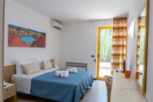 Llit o llits en una habitació de Hotel Santa Lucia
