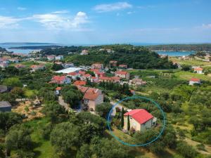 an aerial view of a house with a red roof at Apartment Kolic - RAB317 by Interhome in Rab