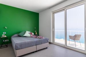 Posteľ alebo postele v izbe v ubytovaní Villas d'Orlando - with private pool and sea view
