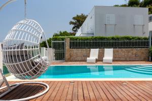 Bazén v ubytovaní Villas d'Orlando - with private pool and sea view alebo v jeho blízkosti