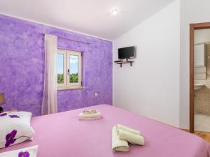Posteľ alebo postele v izbe v ubytovaní Holiday Home Baretuni by Interhome