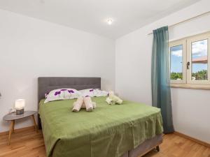 Posteľ alebo postele v izbe v ubytovaní Holiday Home Baretuni by Interhome