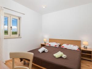 Posteľ alebo postele v izbe v ubytovaní Holiday Home Baretuni by Interhome