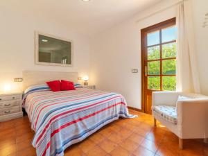 A bed or beds in a room at Holiday Home Ca Na Rosa by Interhome