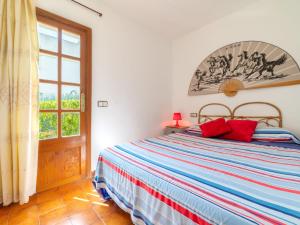 A bed or beds in a room at Holiday Home Ca Na Rosa by Interhome