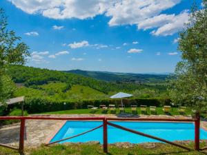 a pool with a view of the mountains at Holiday Home Badia a Passignano by Interhome in Badia A Passignano