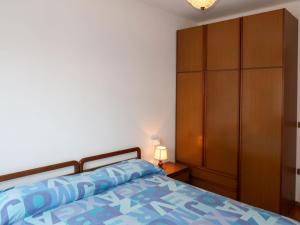 A bed or beds in a room at Apartment Pancheri by Interhome