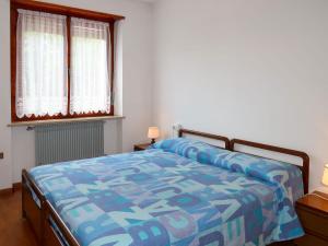 A bed or beds in a room at Apartment Pancheri by Interhome
