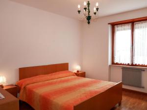 A bed or beds in a room at Apartment Pancheri by Interhome