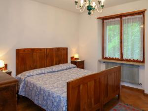 A bed or beds in a room at Apartment Pancheri by Interhome
