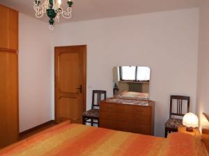 A bed or beds in a room at Apartment Pancheri by Interhome