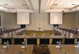 a large conference room with tables and chairs at Eka Hotel Nairobi in Nairobi
