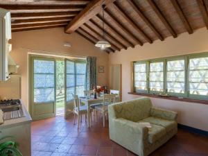 a living room with a couch and a table at Holiday Home Nido del Sorbino by Interhome in Fondaccio