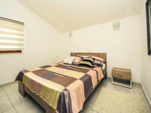 Ένα ή περισσότερα κρεβάτια σε δωμάτιο στο Apartment Mirjana-1 by Interhome