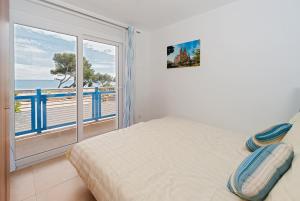 En eller flere senger på et rom på Apartamentos Mar y Sol