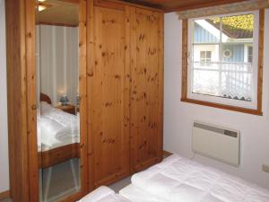 a bedroom with a bunk bed and a window at Holiday Home Useriner See-4 by Interhome in Userin