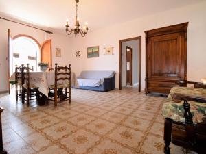 a bedroom with a bed and a table and chairs at Apartment Casa Teste di Moro by Interhome in Giardini Naxos