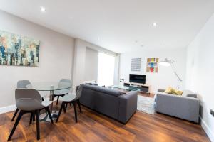 A seating area at Modern City Living Apartments at The Assembly Manchester