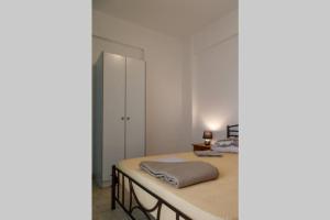 Postel nebo postele na pokoji v ubytování Ρήγας: Όμορφα στο Μεσολόγγι, Διαμέρισμα Β2