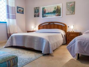 Postel nebo postele na pokoji v ubytování Holiday Home Borgo Sacramento by Interhome