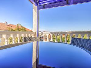 a view from a balcony with a large window at Apartment File-4 by Interhome in Zambratija