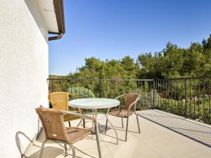 a patio with a table and chairs on a balcony at Apartment File-5 by Interhome in Zambratija