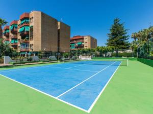 a tennis court in front of a building at Apartment La Najarra by Interhome in Almuñécar