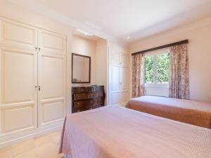 A bed or beds in a room at Villa Son Maguet by Interhome