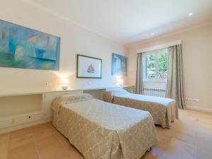 A bed or beds in a room at Villa Son Maguet by Interhome