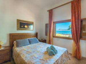 Postel nebo postele na pokoji v ubytování Holiday Home Sa Marina by Interhome