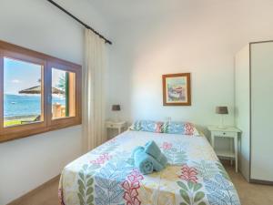 Postel nebo postele na pokoji v ubytování Holiday Home Sa Marina by Interhome