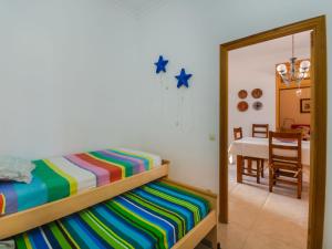 Postel nebo postele na pokoji v ubytování Holiday Home Sa Marina by Interhome