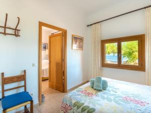 Postel nebo postele na pokoji v ubytování Holiday Home Sa Marina by Interhome